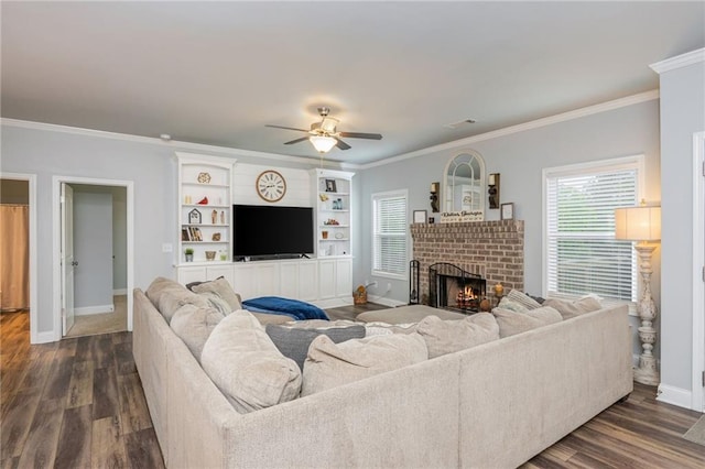 48 Violet Ln, Dallas, GA 30132 - living area with ornamental molding, a ceiling fan, a brick fireplace, baseboards, and dark wood-style flooring
