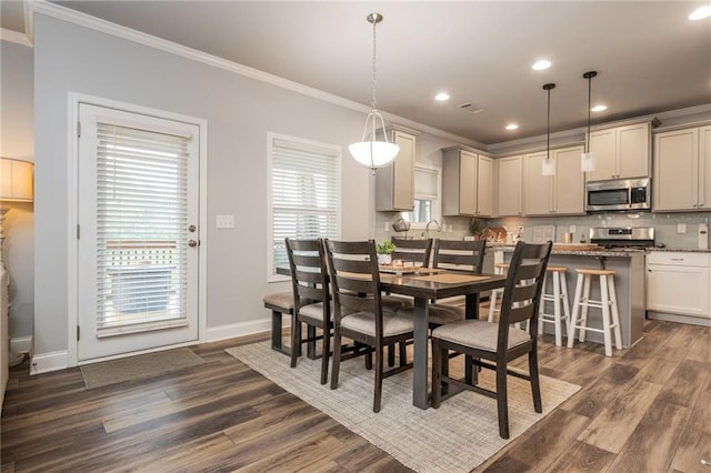 48 Violet Ln, Dallas, GA 30132 - dining area featuring ornamental molding, dark wood finished floors, baseboards, and recessed lighting