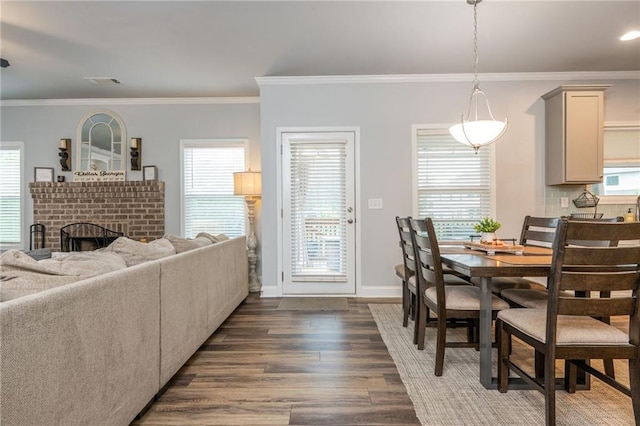 48 Violet Ln, Dallas, GA 30132 - dining room with dark wood-style floors, a brick fireplace, ornamental molding, and baseboards