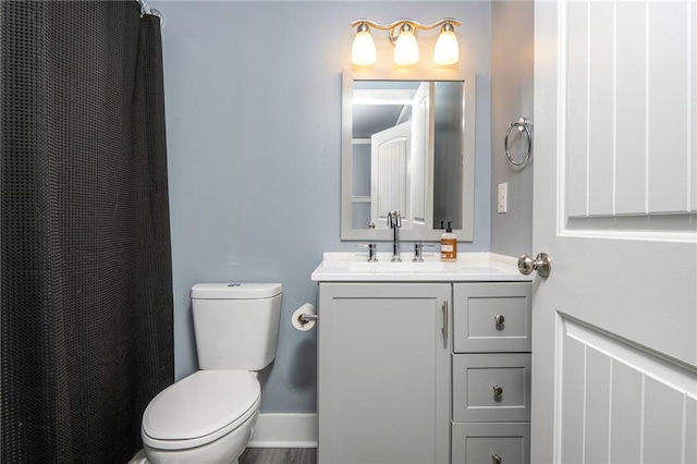 48 Violet Ln, Dallas, GA 30132 - full bathroom featuring vanity, toilet, baseboards, and curtained shower