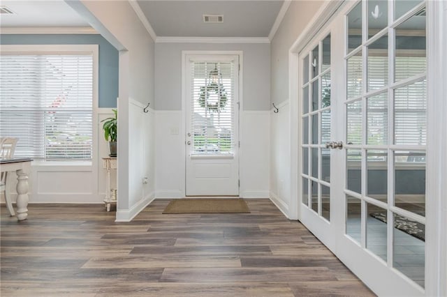 48 Violet Ln, Dallas, GA 30132 - entrance foyer with french doors, a wainscoted wall, wood finished floors, crown molding, and a decorative wall
