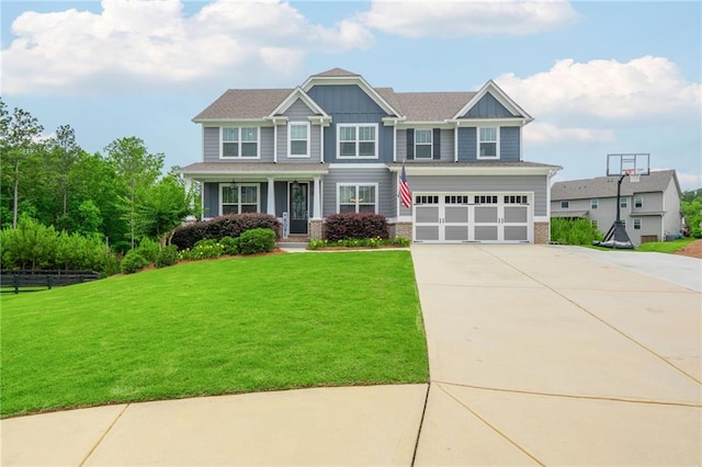 48 Violet Ln, Dallas, GA 30132 - craftsman-style home with concrete driveway, a garage, a porch, and board and batten siding