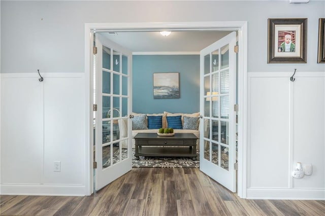 48 Violet Ln, Dallas, GA 30132 - doorway to outside with wood finished floors, a wainscoted wall, and a decorative wall