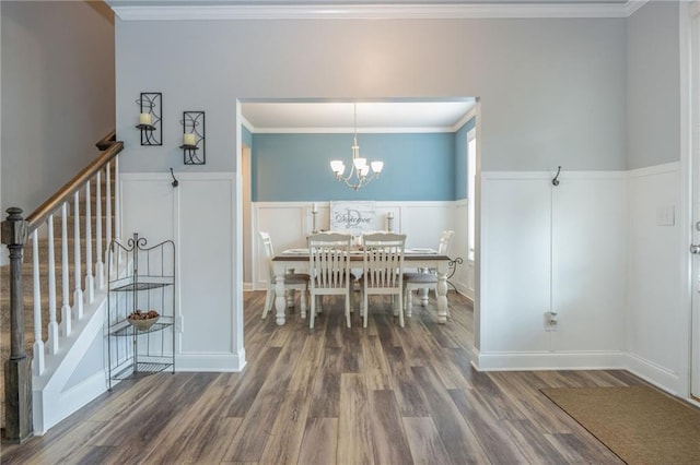 48 Violet Ln, Dallas, GA 30132 - dining space featuring wood finished floors, stairs, a wainscoted wall, a chandelier, and ornamental molding
