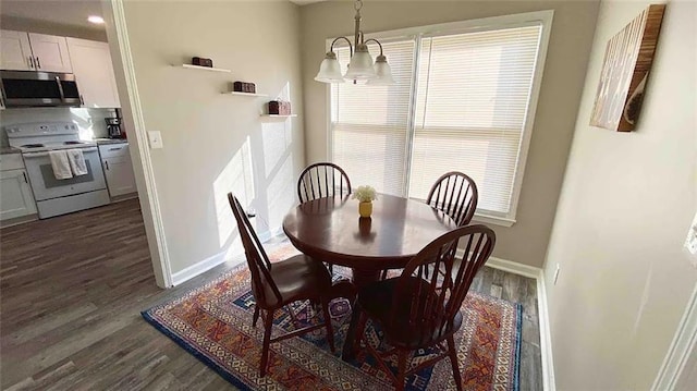 554 Holderness St SW, Atlanta, GA 30310 - dining room with baseboards, dark wood-style flooring, and a chandelier