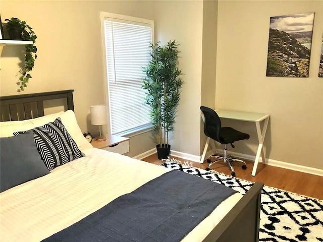 554 Holderness St SW, Atlanta, GA 30310 - bedroom featuring baseboards and wood finished floors