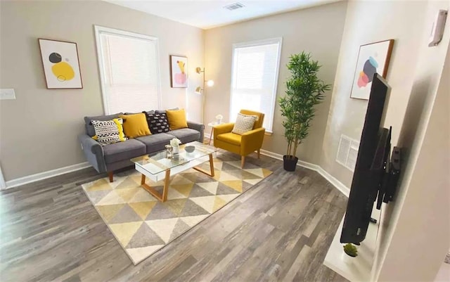 554 Holderness St SW, Atlanta, GA 30310 - living area with baseboards, visible vents, and wood finished floors