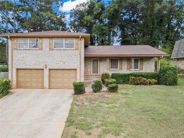 tri-level home with a garage and a front lawn