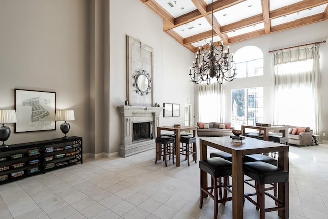 3777 Peachtree Rd NE Unit 1007, Atlanta, GA 30319 - dining area with a towering ceiling, coffered ceiling, beamed ceiling, a fireplace, and tile patterned flooring