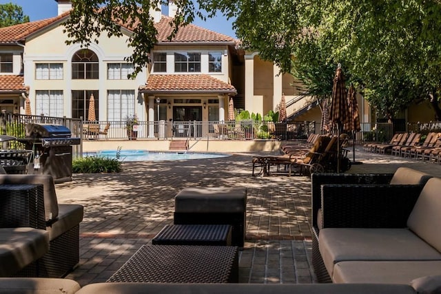 3777 Peachtree Rd NE Unit 1007, Atlanta, GA 30319 - back of property featuring a tile roof, fence, a patio, and a chimney