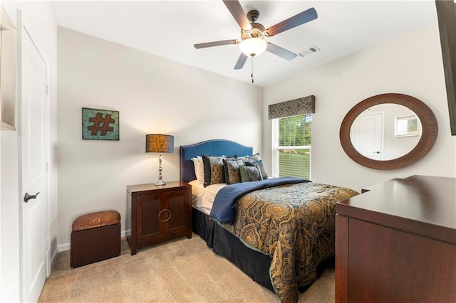 carpeted bedroom with ceiling fan