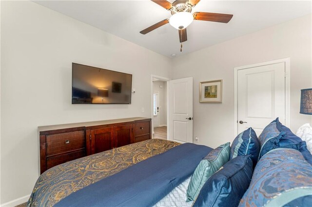 bedroom featuring wood-type flooring and ceiling fan