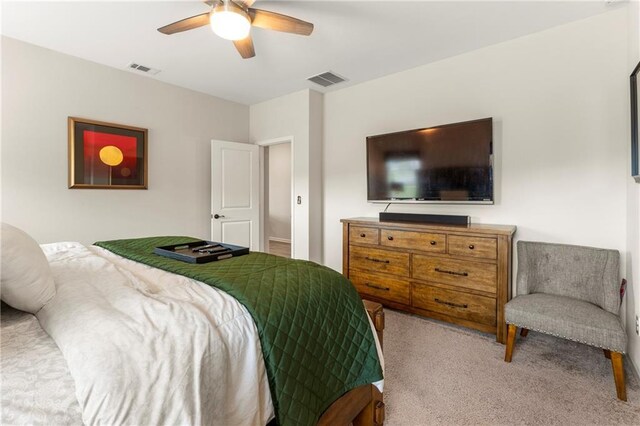 bedroom with light carpet and ceiling fan