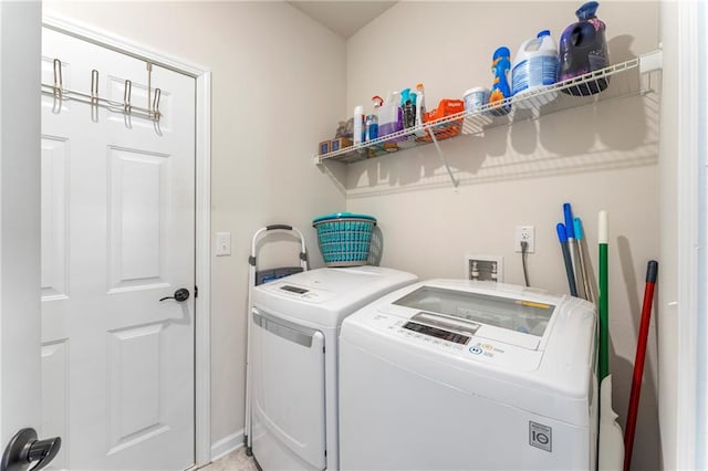 washroom featuring washer and clothes dryer