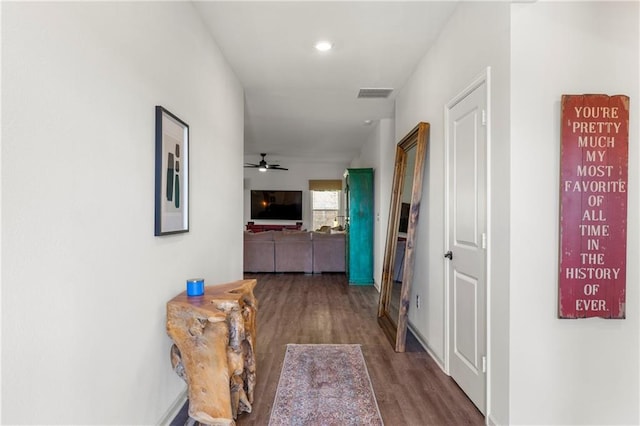 corridor featuring hardwood / wood-style floors