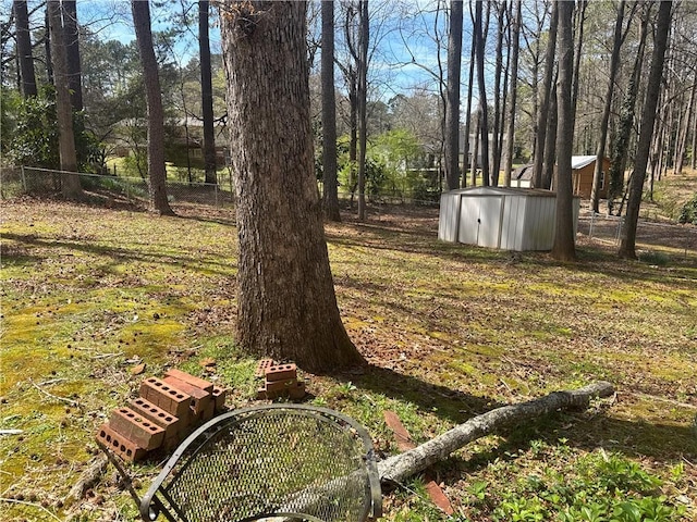 2943 E Howell Dr, Lawrenceville, GA 30044 - view of yard with fence, a storage unit, and an outdoor structure