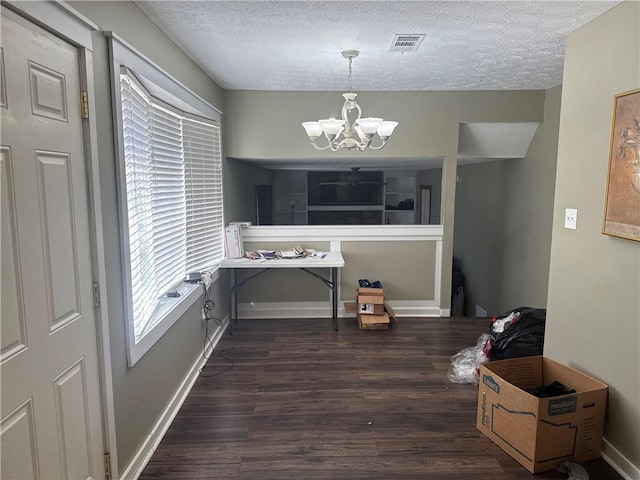 2943 E Howell Dr, Lawrenceville, GA 30044 - dining space featuring a textured ceiling, visible vents, wood finished floors, and a chandelier