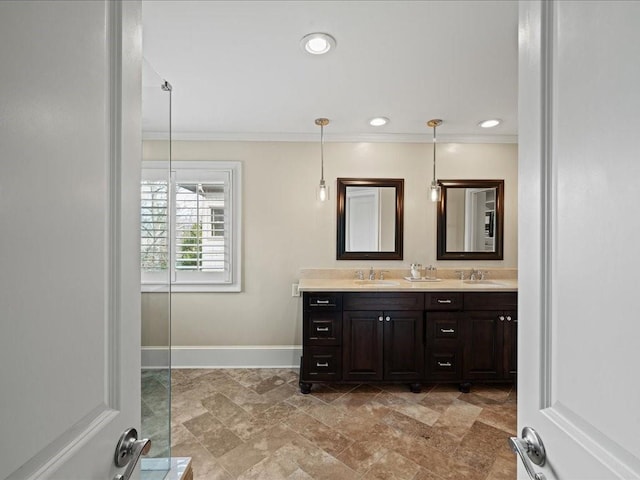 bathroom with vanity and ornamental molding