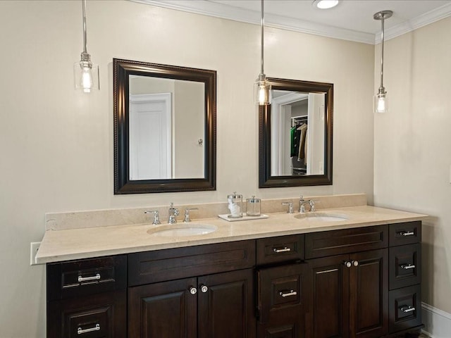 bathroom with crown molding and vanity