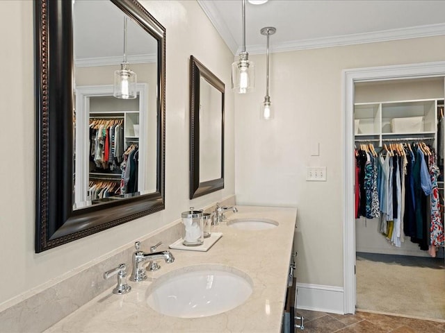 bathroom featuring ornamental molding and vanity