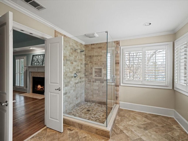 bathroom with walk in shower and ornamental molding