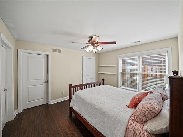 bedroom featuring dark hardwood / wood-style floors and ceiling fan