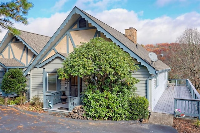 view of front of property with a wooden deck