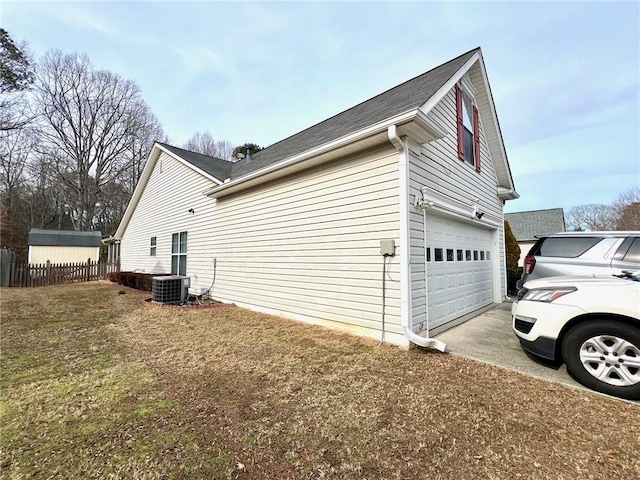 view of home's exterior with a yard and central AC