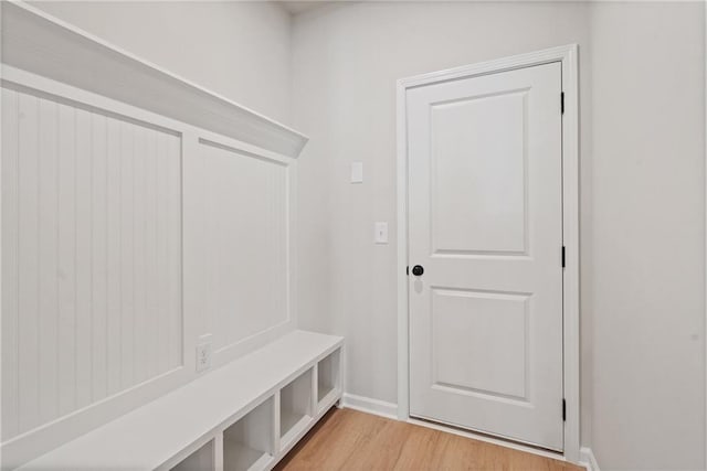 mudroom featuring baseboards and light wood-type flooring