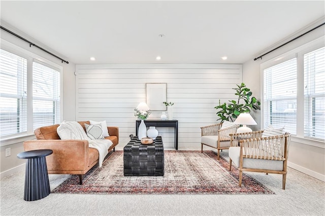 living area featuring recessed lighting, baseboards, and carpet floors