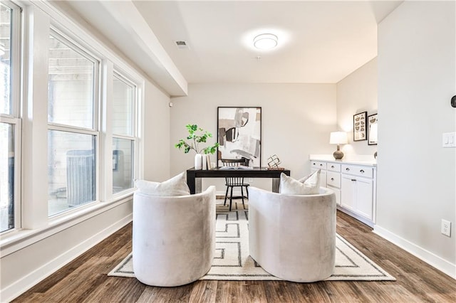 office space featuring visible vents, baseboards, and dark wood-style flooring