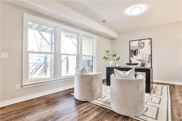 interior space featuring visible vents, baseboards, and dark wood-style floors