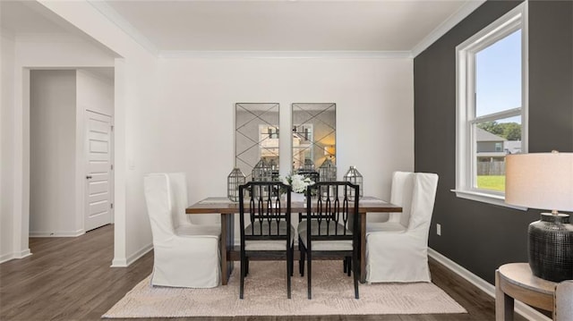 dining area with crown molding and dark wood-type flooring