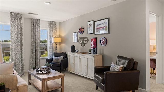 living area with light colored carpet