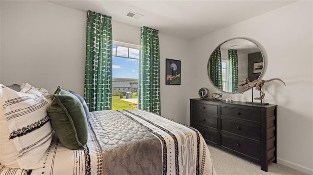 bedroom featuring light carpet