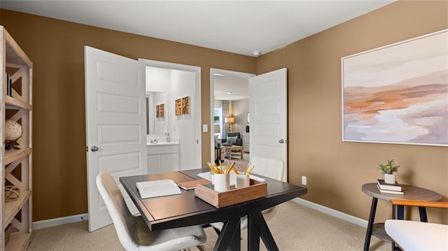 dining room featuring light carpet