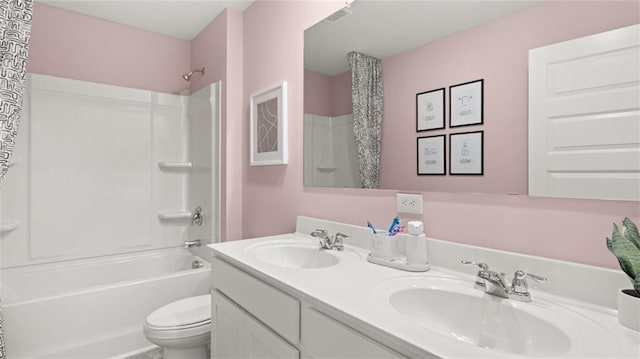 full bathroom featuring shower / bathing tub combination, vanity, and toilet