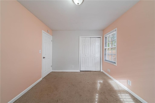 unfurnished bedroom with a closet