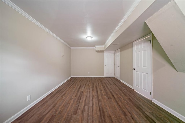 basement with dark hardwood / wood-style floors and crown molding