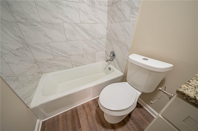 bathroom with hardwood / wood-style flooring and toilet