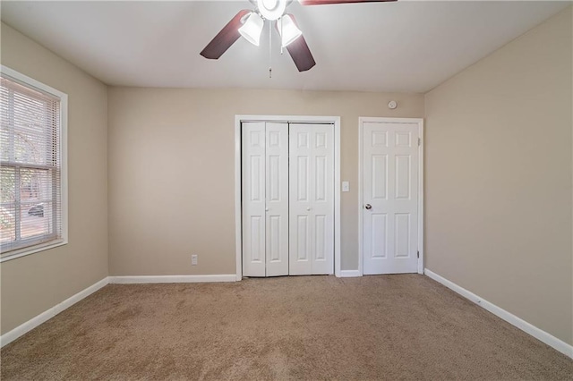 unfurnished bedroom with light carpet and ceiling fan