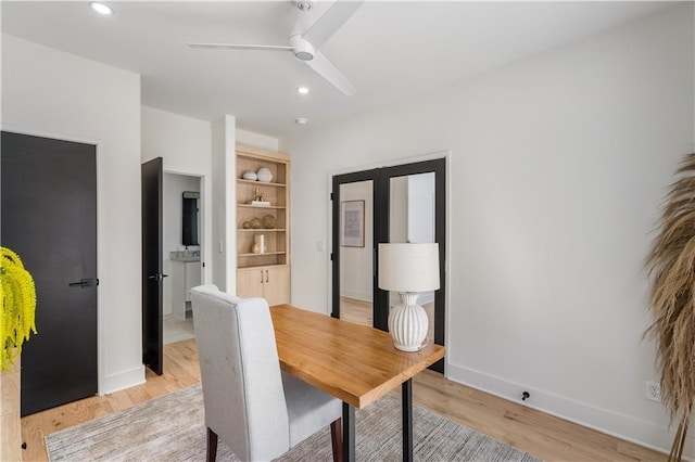 dining space featuring light wood-type flooring, baseboards, a ceiling fan, and recessed lighting