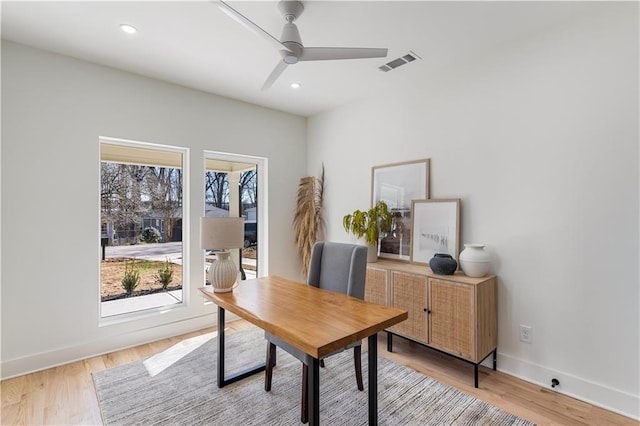 home office featuring recessed lighting, visible vents, light wood-style floors, ceiling fan, and baseboards