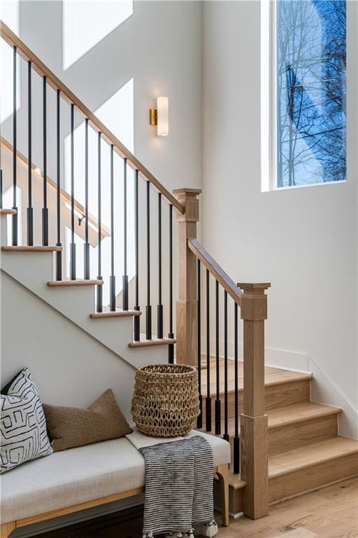 staircase featuring wood finished floors