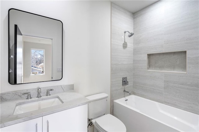 bathroom with toilet, shower / tub combination, and vanity