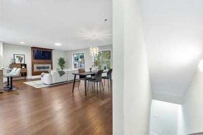 living room featuring hardwood / wood-style floors and a chandelier