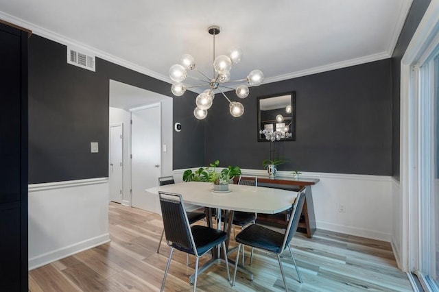 46 Ivy Rdg NE, Atlanta, GA 30342 - dining room featuring a chandelier, wood finished floors, crown molding, and baseboards