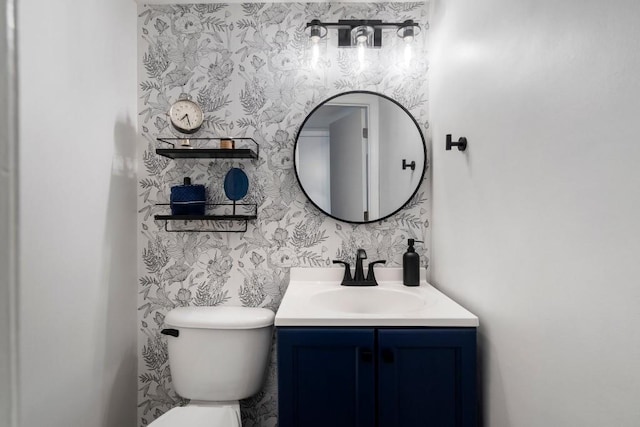 46 Ivy Rdg NE, Atlanta, GA 30342 - bathroom featuring vanity, toilet, and wallpapered walls
