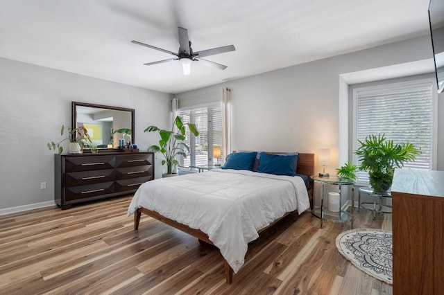 46 Ivy Rdg NE, Atlanta, GA 30342 - bedroom with wood finished floors, baseboards, and a ceiling fan