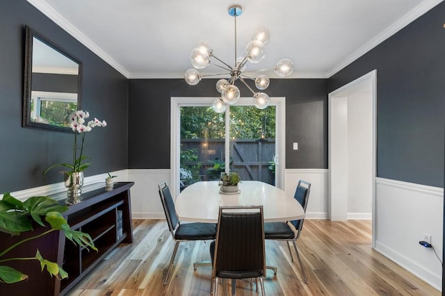46 Ivy Rdg NE, Atlanta, GA 30342 - dining area featuring plenty of natural light, wainscoting, a chandelier, wood finished floors, and ornamental molding